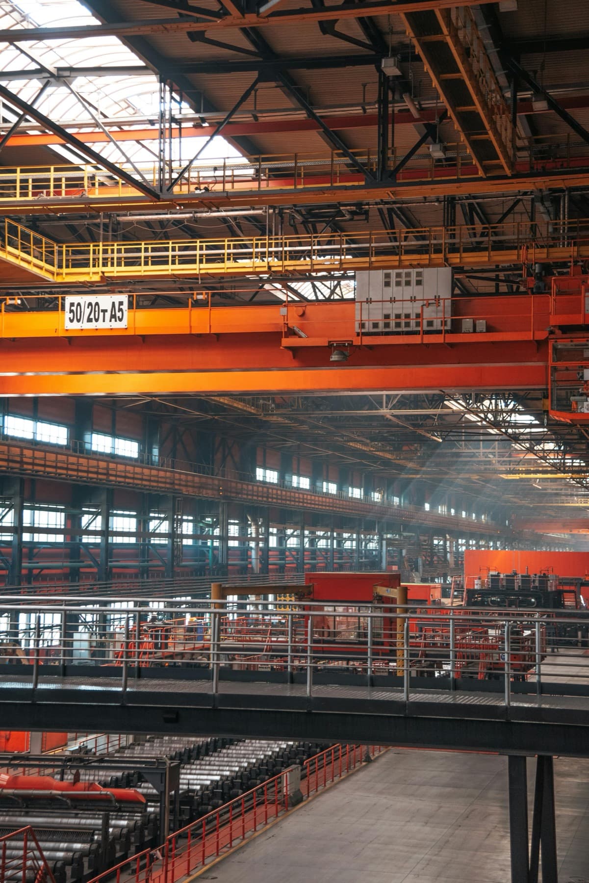 Heavy industrial overhead crane structure inside a manufacturing plant